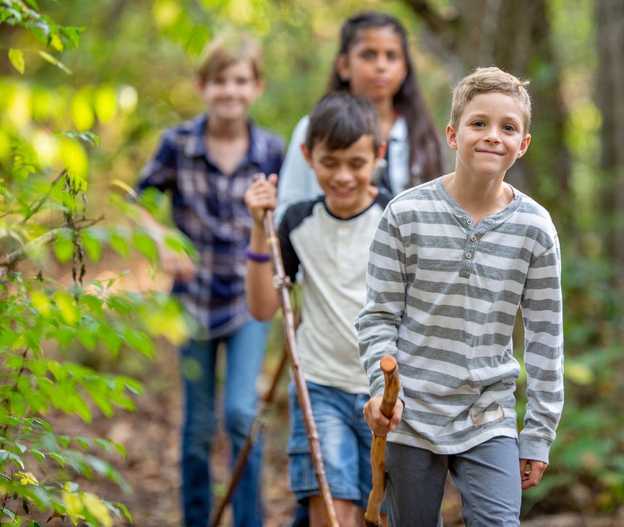 Kids walking in the woods